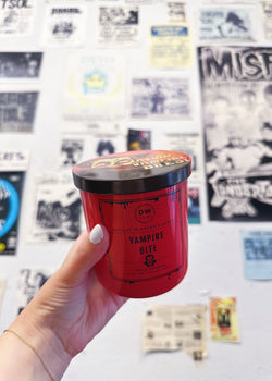 Hand holding Vampire Bite Candle Single Wick