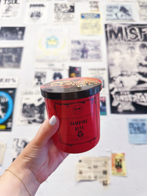 Hand holding Vampire Bite Candle Single Wick