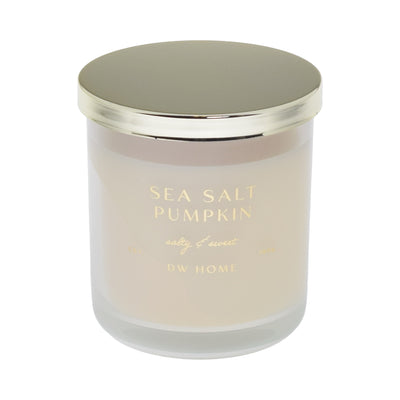 Candle with 'Sea Salt Pumpkin' and 'DW Home' text on a white background