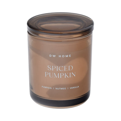 Brown DW Home candle labeled 'Spiced Pumpkin'