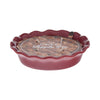 Red pie-shaped candle with 'Sweet Apple Pie' text on a white background