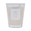 White vase, Vanilla Apple candle with a label on a white background