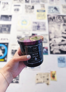 Hand holding Witch Spells Candle Single Wick