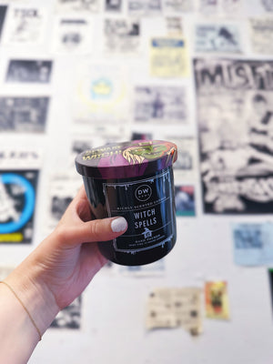 Hand holding Witch Spells Candle Single Wick