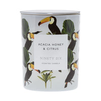 Acacia Honey and Citrus, large double wick candle. White candle with zebra and palm tree graphic.